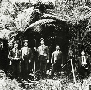 Geological Survey Party at Walhalla, 1898 Black and white photo of five men and a camera on a tripod standing in a wooded area