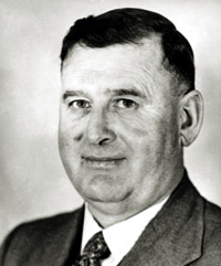 Black and white photo of David Thomas looking side on toward the camera