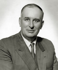 Black and white photo of doctor Boutakoff looking straight towards the camera