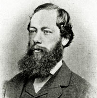 Black and white photo of Richard Daintree wearing a suit and beard