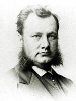 Black and white photo of Richard Kitto wearing a suit and beard