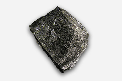 Wolframite from Wilks Creek, Marysville, Victoria (Scale: 6 cm) A fragment of tungsten. It is black in colour.