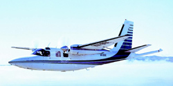 A light aircraft with a fixed wing going across the top of the plane
